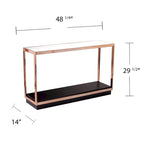 Mesa consola estrecha con superficie de cristal, estructura metálica y estante de almacenamiento