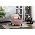 Sillón de tela de lino con detalles de tachuelas y patas de madera maciza