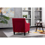 Sillón de tela de lino con detalles de tachuelas y patas de madera maciza