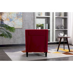 Sillón de tela de lino con detalles de tachuelas y patas de madera maciza
