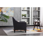 Sillón de tela de lino con detalles de tachuelas y patas de madera maciza